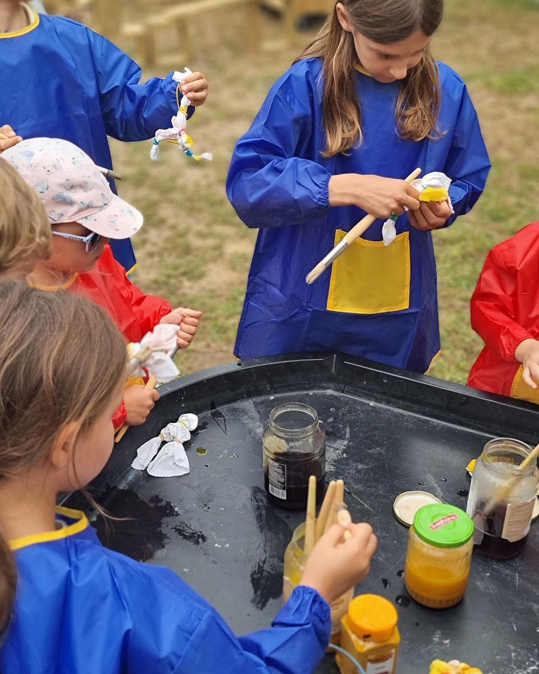 Summer Camp 3 Children painting outdoors