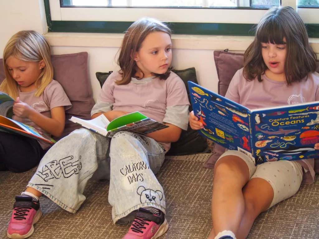 Home 32 Children reading together
